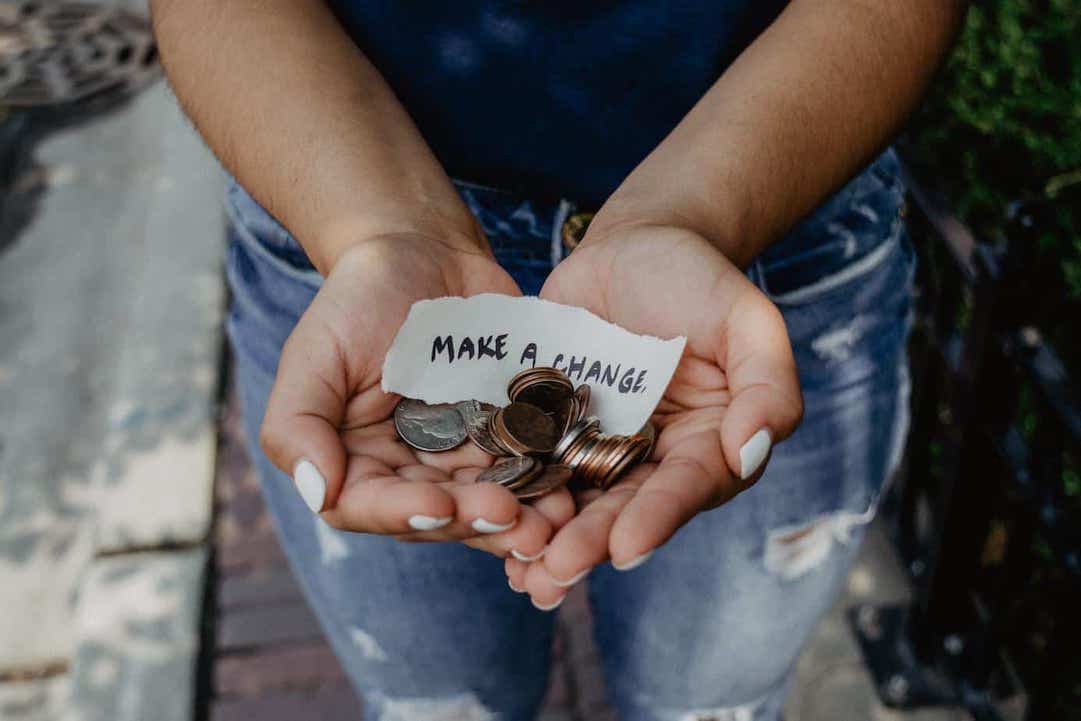 Hands holding change = Photo by Katt Yukawa - Pexels.com
