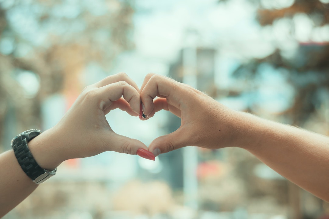 Photo of hands joining in a heart sign. Photo from Nothing Ahead on Pexels