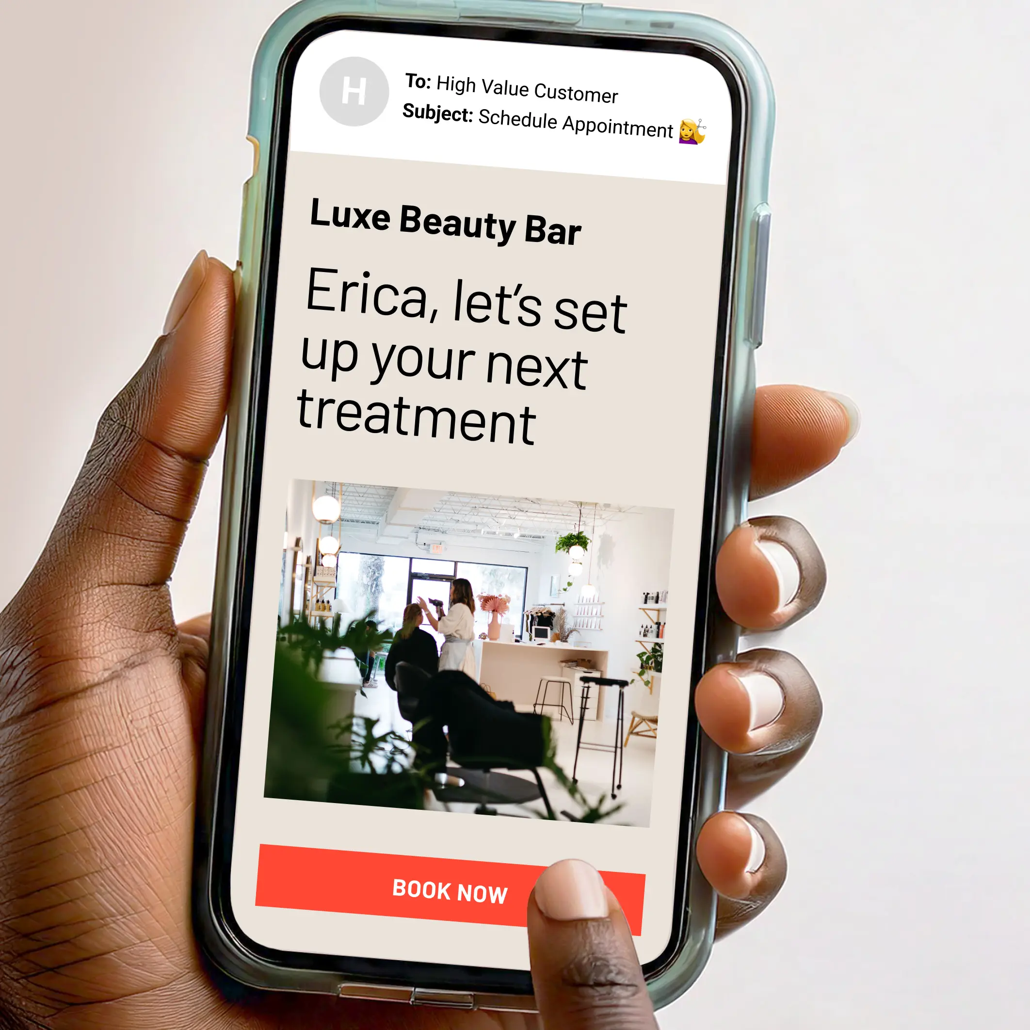A salon email shown on a phone.